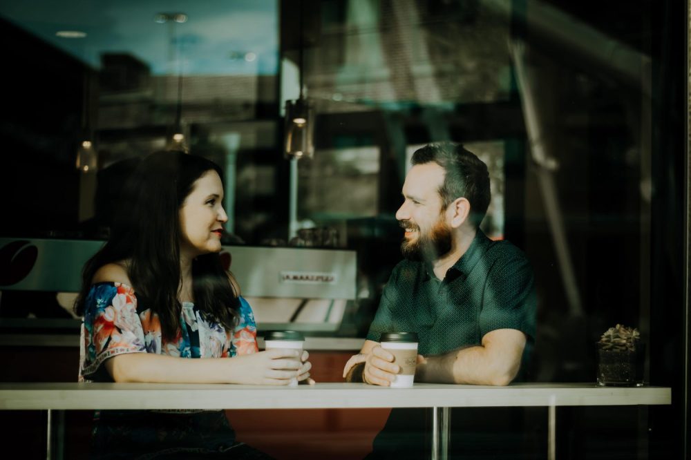 Two friends talking in a coffee shop